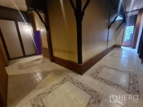 Retail Space for rent in Watthana, Bangkok - Long hallway with tiled borders, wood trims and a glass‑block door at the end.
