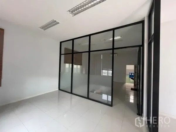 Factory for rent in Lam Luk Ka, Pathum Thani - Private meeting room with black-framed glass partition.