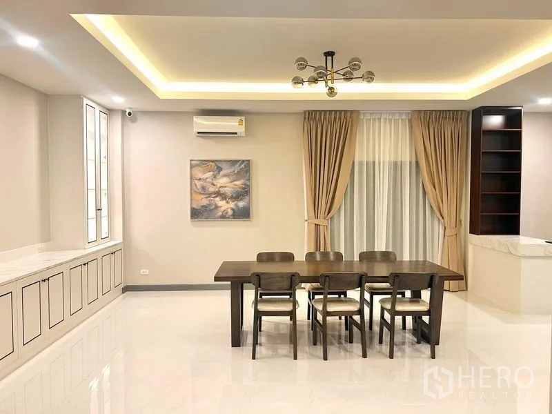 Detached House for rent - Open-plan dining room with built-in cabinetry and chandelier.