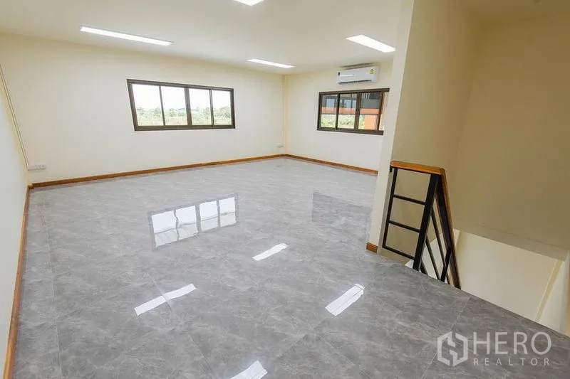 Factory for sale in Bang Sao Thong, Samut Prakan - Second-floor office space with windows on two sides, LED lighting and tiled floors.