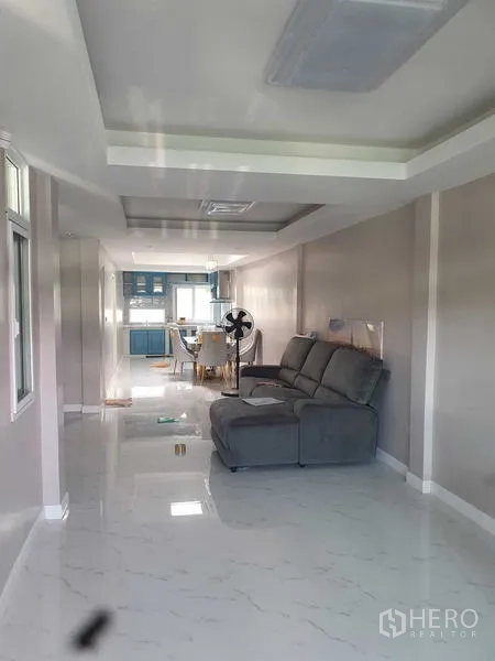 Home Office for rent in Suan Luang, Bangkok - Open-plan living and dining area flowing toward a built-in kitchen.