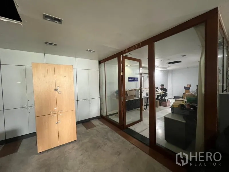Retail Space for rent in Bang Rak, Bangkok - Lobby zone with built-in cabinets and a glass-framed meeting room inside the retail space.