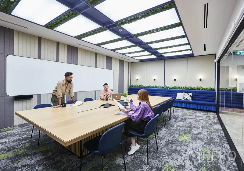 Office Space for rent in Pathum Wan, Bangkok - Glass-walled conference room with a long wooden table, ceiling light panels and a whiteboard.
