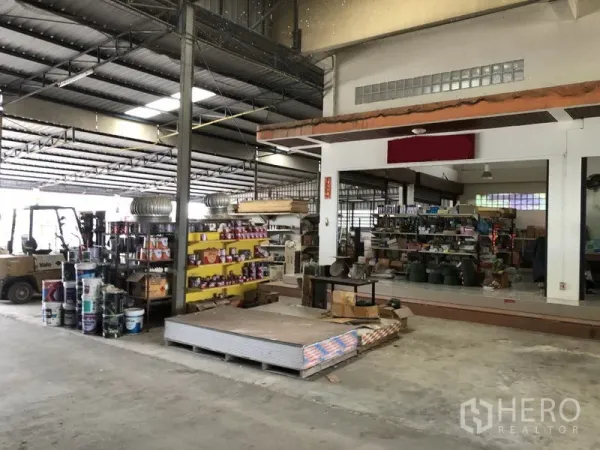 Warehouse for rent in Sai Noi, Nonthaburi - Warehouse interior with forklift, product racks and high metal truss ceiling for easy operations.