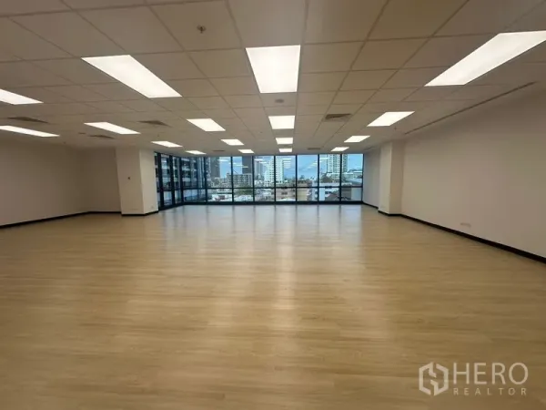 Office Space for rent in Chatuchak, Bangkok - Large office floorplate facing wall-to-wall windows with Bangkok skyline views.