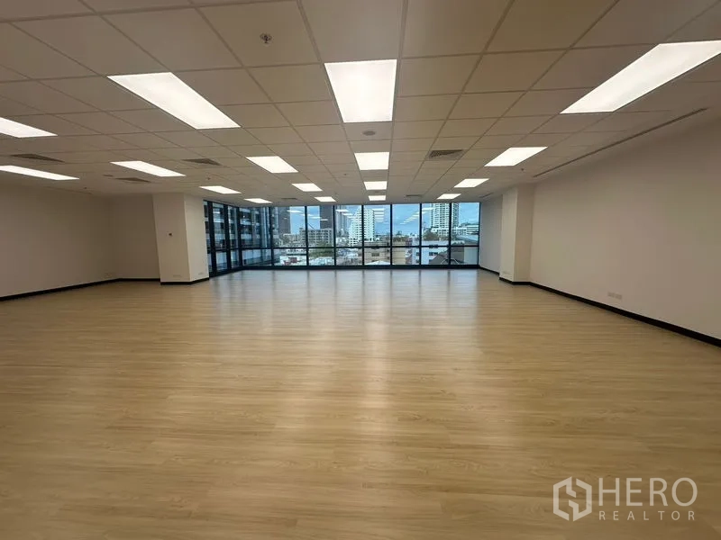 Office Space for rent in Chatuchak, Bangkok - Large office floorplate facing wall-to-wall windows with Bangkok skyline views.