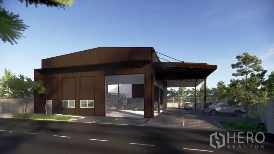 Warehouse for rent in Bang Kapi, Bangkok - Modern warehouse exterior with large loading canopy, drive-in bays and parking area.