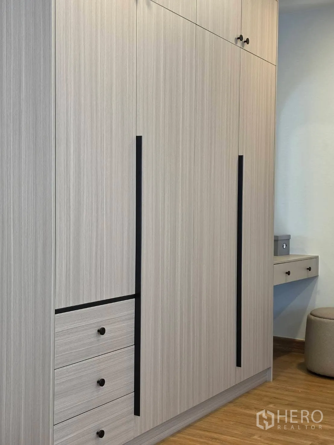 Detached House for rent in Bang Phli, Samut Prakan - Built-in wood wardrobe with long black handles and drawers.