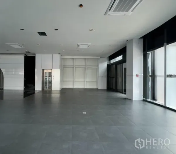 Retail Space for rent in Watthana, Bangkok - Bright retail floor with expansive glazing, elevator core, and flexible open layout ready for fit-out.