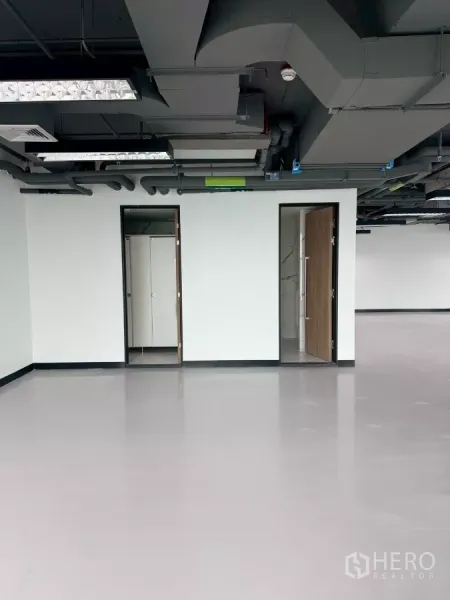 Office Space for rent in Din Daeng, Bangkok - Internal restrooms and storage accessed by two doors within the office suite.