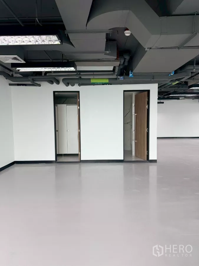 Office Space for rent in Din Daeng, Bangkok - Internal restrooms and storage accessed by two doors within the office suite.