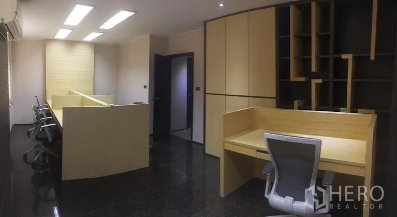 Home Office for rent in Suan Luang, Bangkok - Open-plan office space with built-in desks, shelving and ergonomic chairs.