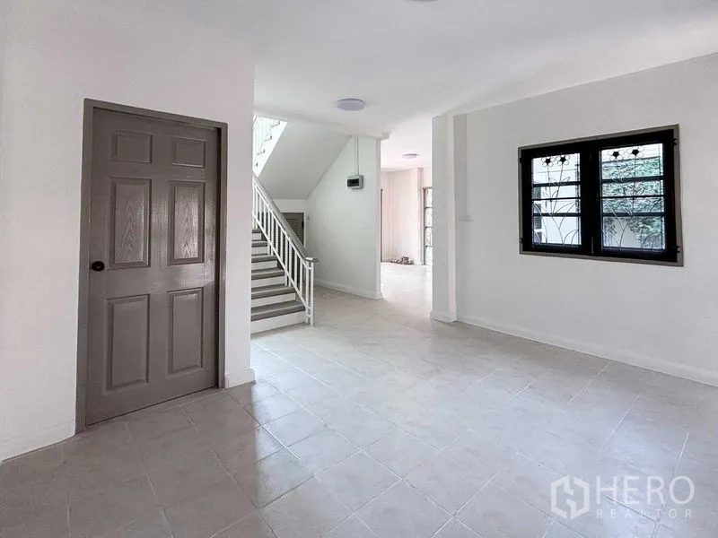 Detached House for rent or sale - Open-plan ground floor with staircase, tiled floor and window.