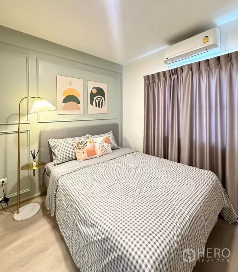 Townhouse for rent in Prawet, Bangkok - Guest bedroom from another angle showing air conditioner and taupe curtains.
