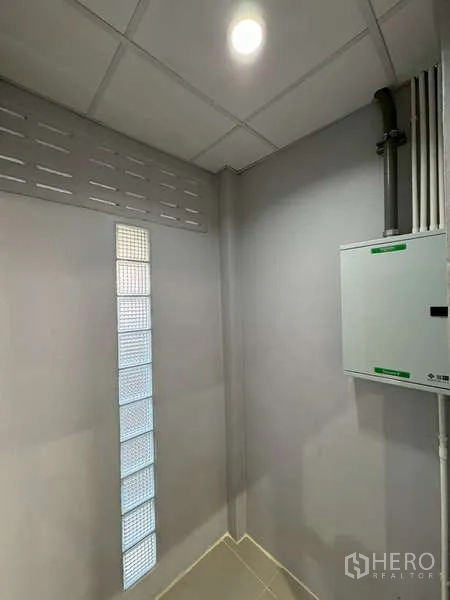 Warehouse for rent in Bang Phli, Samut Prakan - Electrical control panel room with ventilation blocks and ceiling light