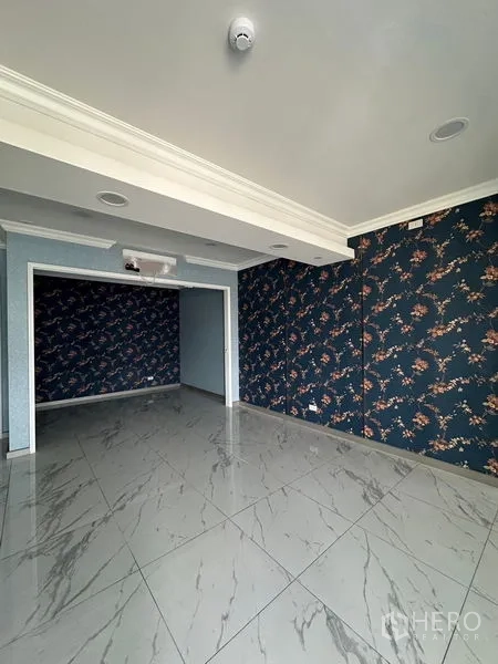 Retail Space for rent in Bang Na, Bangkok - Flexible back room with floral feature wall, drop ceiling and spotlights for display or seating.