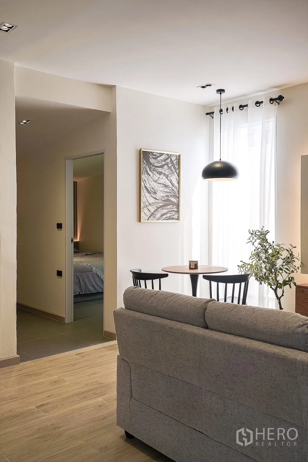 Detached House for rent in Huai Khwang, Bangkok - View from the living area toward a bedroom and compact dining corner by the window.
