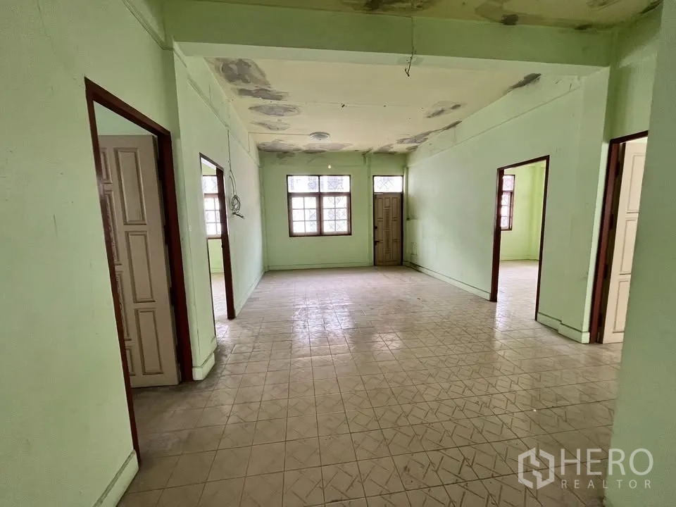 Detached House for rent in Suan Luang, Bangkok - Upper floor landing with multiple doorways and tiled floor, ready to renovate.