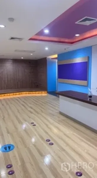 Retail Space for rent in Bang Rak, Bangkok - Reception counter with wooden floors and recessed ceiling lights inside the retail space.