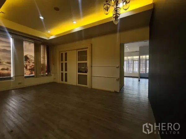 Retail Space for rent in Watthana, Bangkok - Private room with sliding door, warm cove lighting, and large windows.