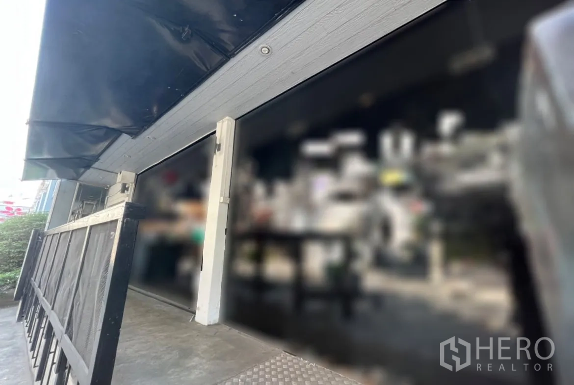 Retail Space for rent in Watthana, Bangkok - Close-up of glass shopfront with black awning and ramped entrance.