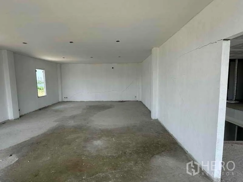 Warehouse for rent in Sai Noi, Nonthaburi - Upper-floor office room with recessed lights and views across the site, ready to customize.