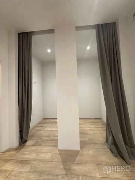 Home Office for rent in Phra Khanong, Bangkok - Two curtained alcoves with recessed lights and wood floors.