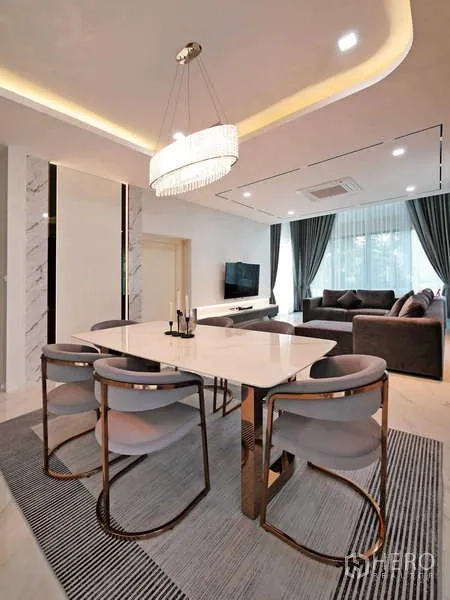 Detached House for rent or sale in Thanyaburi, Pathum Thani - Dining space with marble-top table, upholstered chairs and crystal chandelier.