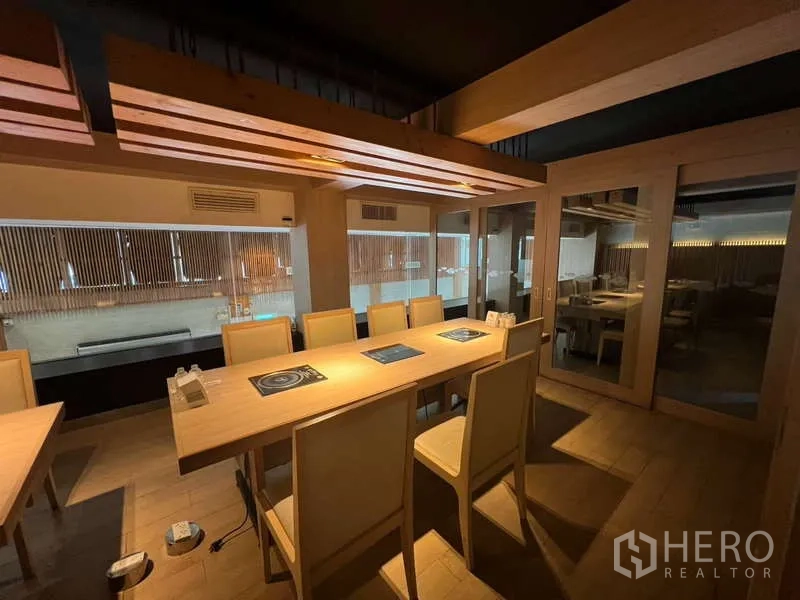 Shophouse for rent or sale in Khlong Toei, Bangkok - Another view of private dining area with built-in hobs and sliding glass doors.