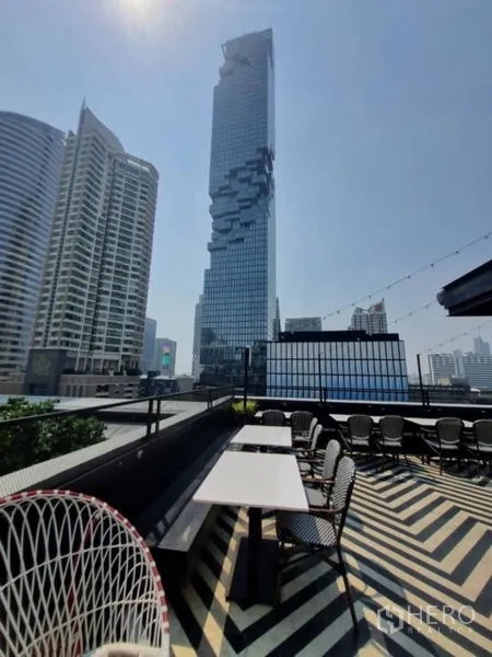Retail Space for rent in Bang Rak, Bangkok - Rooftop seating facing the Mahanakhon tower and cityscape.