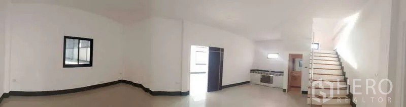 Factory for rent or sale in Sai Noi, Nonthaburi - Ground-floor office area with pantry section, restroom access and stairs to upper floor.