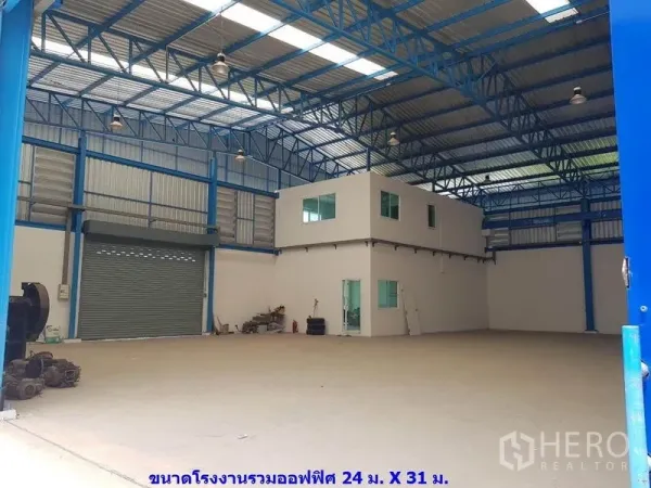 Factory for rent in Samut Sakhon - Open factory floor featuring a two-storey office block and large roller door.