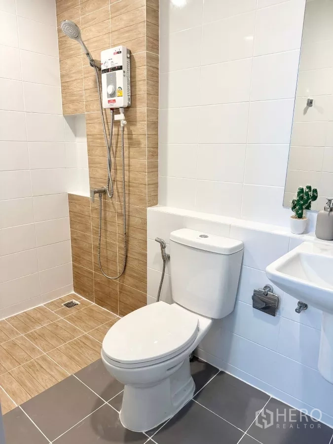 Townhouse for rent in Bang Phli, Samut Prakan - Second bathroom with water heater and tiled shower area.