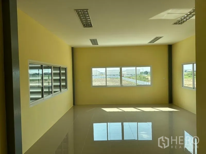Warehouse for rent or sale in Bang Phli, Samut Prakan - Second-floor office with large windows providing natural light and views over the estate.