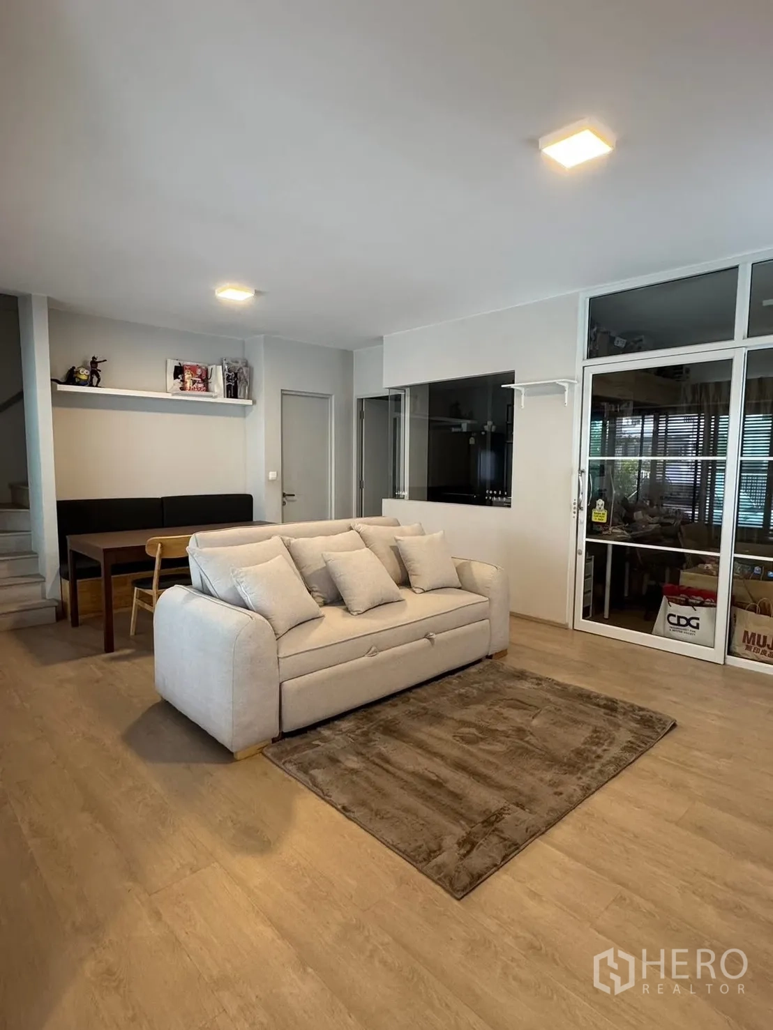 Semi-detached House for rent in Prawet, Bangkok - Contemporary semi-detached house facade with covered carport and landscaped front.