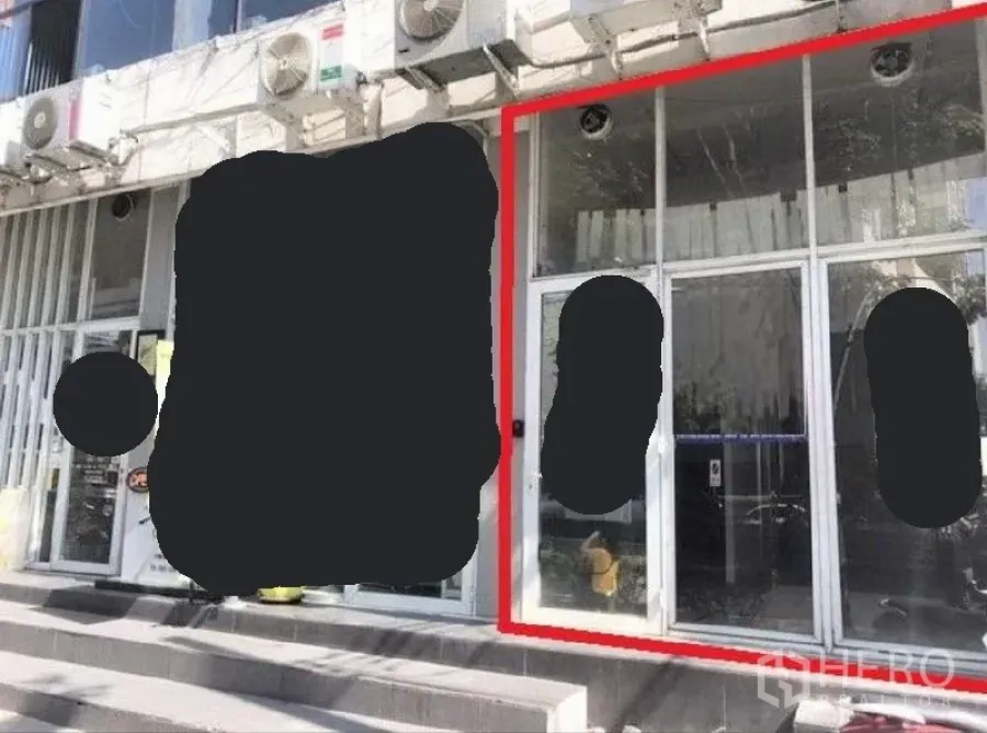 Retail Space for rent in Phaya Thai, Bangkok - Street‑level glass storefront of a retail unit in a commercial building, outlined in red.