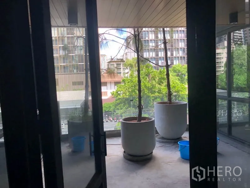 Retail Space for rent in Khlong Toei, Bangkok - Covered balcony with large planters and city views from the retail unit close to BTS Phrom Phong.