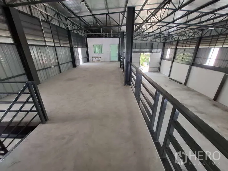 Warehouse for rent or sale in Bang Phli, Samut Prakan - Wide mezzanine walkway leading to enclosed office room.