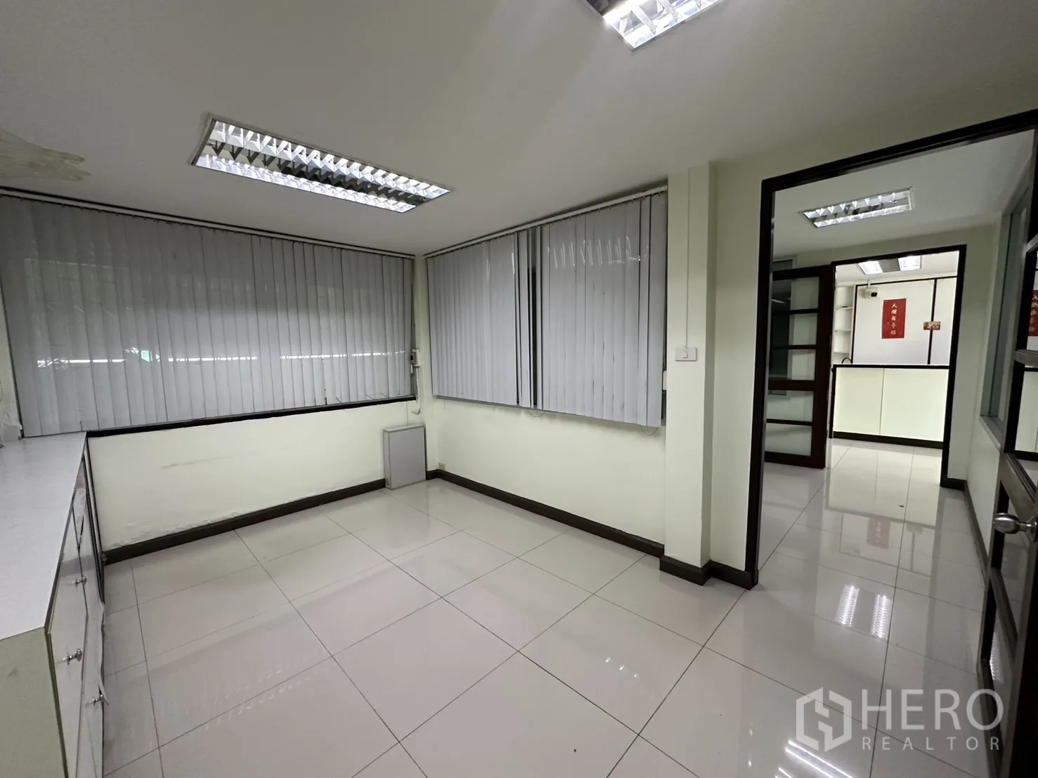 Retail Space for rent in Watthana, Bangkok - Private office room with blinds and tiled floor.