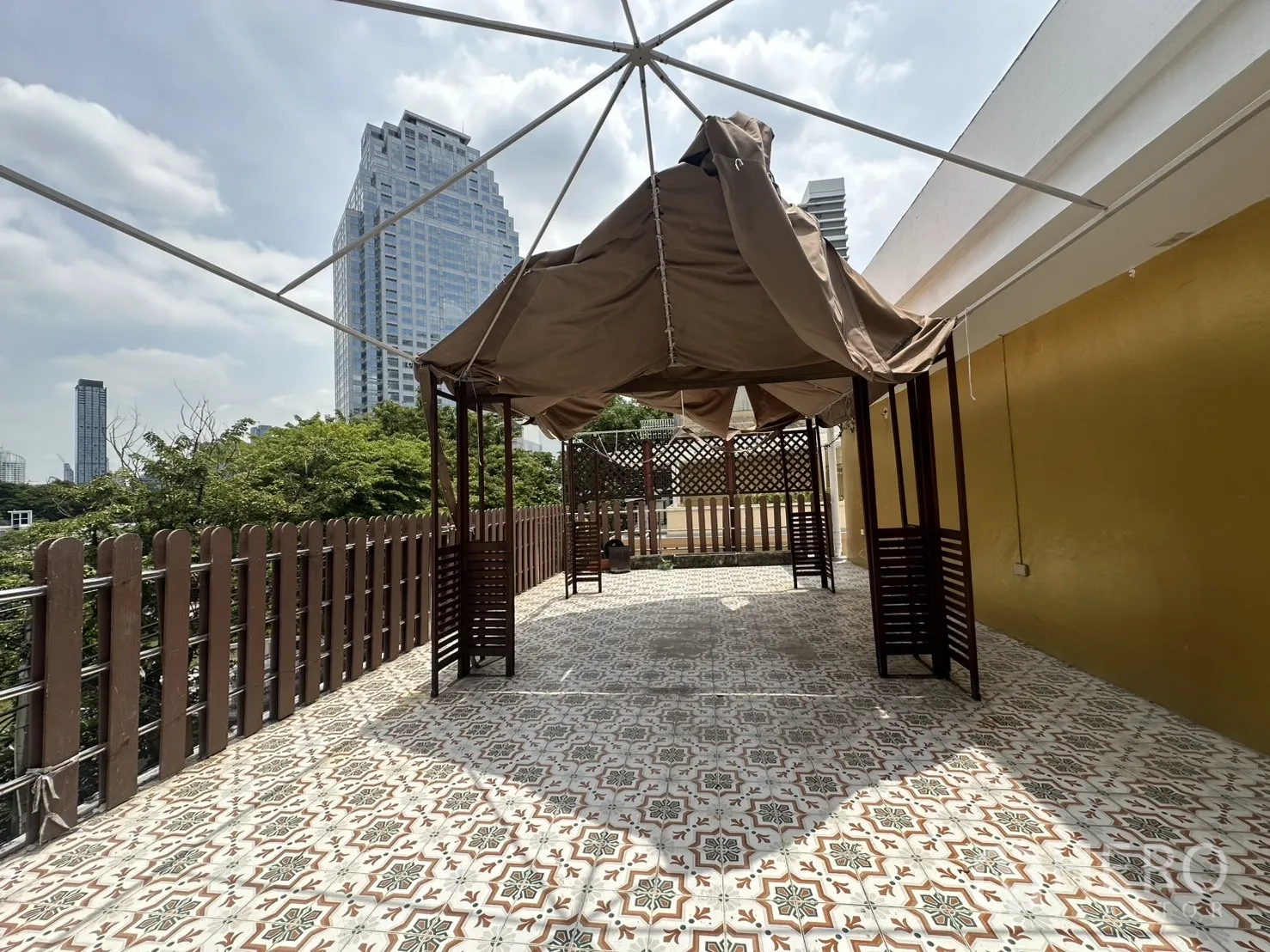Retail Space for rent in Bang Rak, Bangkok - Large outdoor terrace with patterned floor tiles and skyline view.