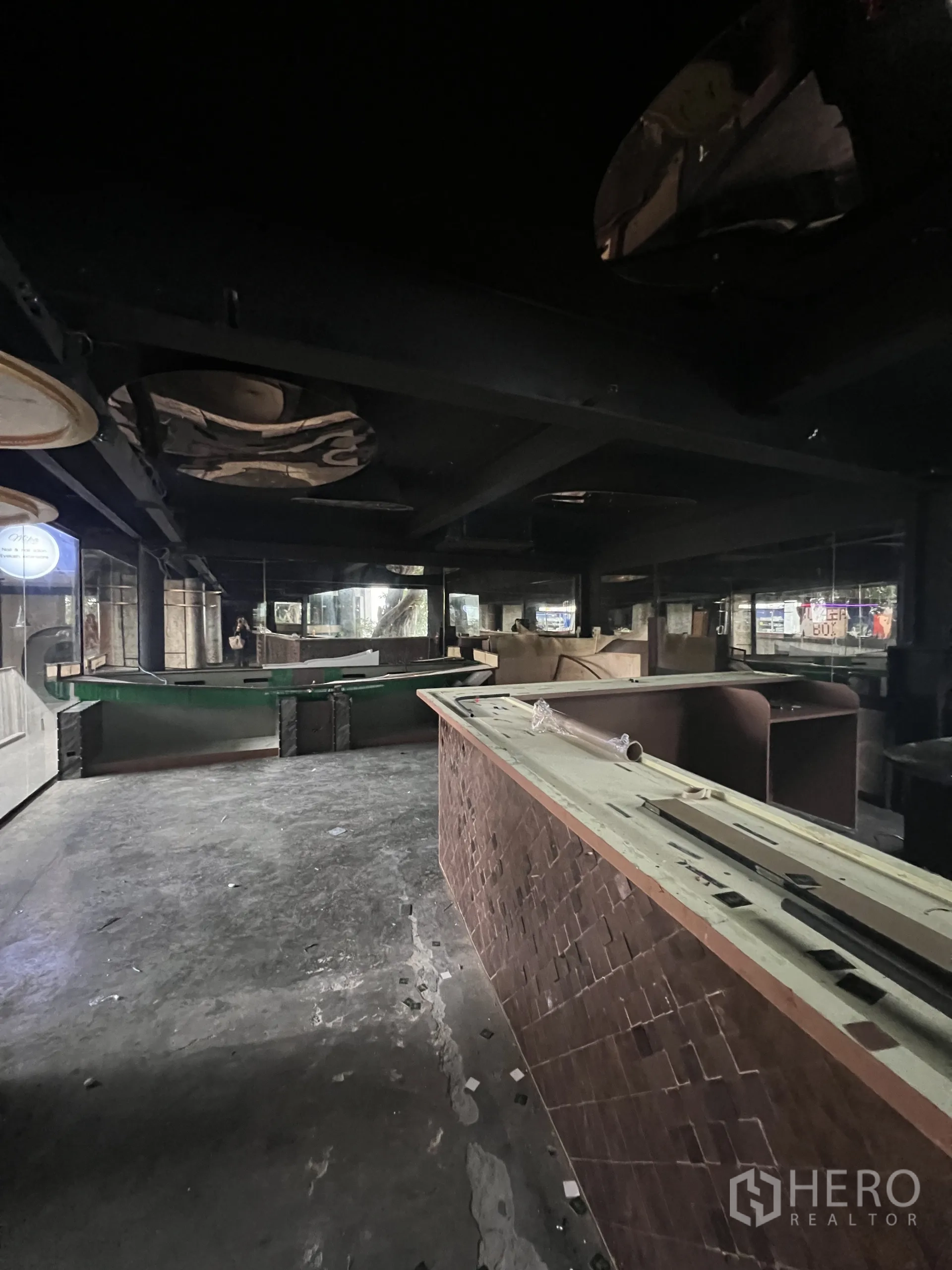 Retail Space for rent in Watthana, Bangkok - Large unfinished bar hall with long counter and open floor space.