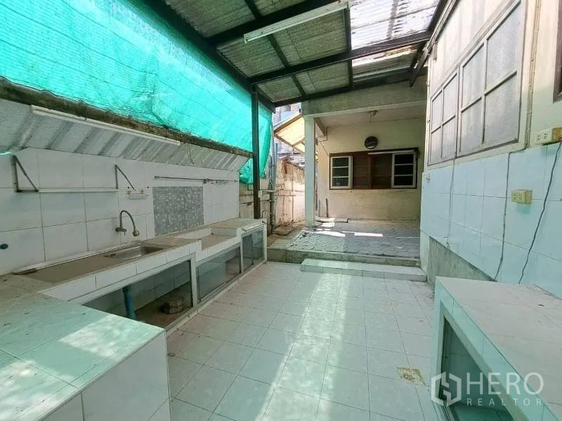 Retail Space for rent in Sathon, Bangkok - Covered outdoor prep area with tiled counters and a sink, ideal for back-of-house.