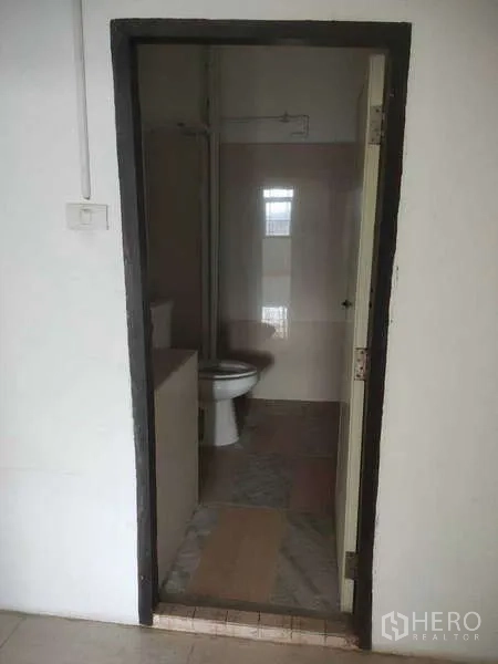 Shophouse for sale in Phra Khanong, Bangkok - Additional bathroom with light tiles and a shower area.