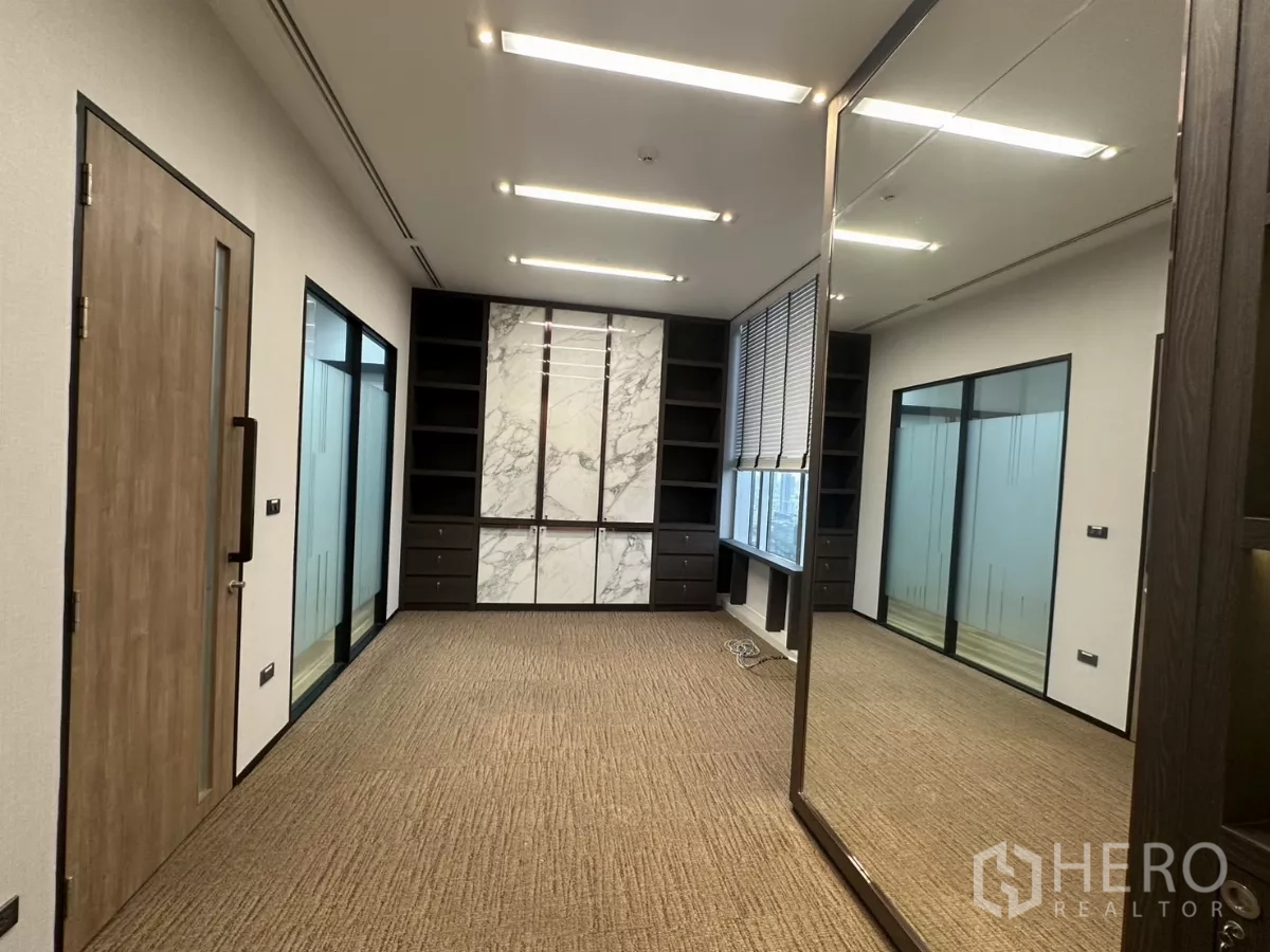 Office Space for rent in Watthana, Bangkok - Alternate view of an executive office with marble panel cabinets and glass partitions.