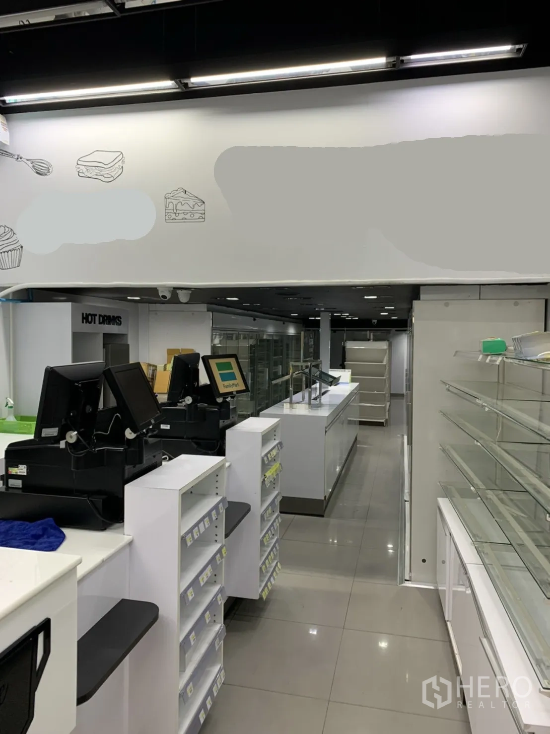 Retail Space for rent in Sathon, Bangkok - Front-of-house counter line with POS stations, glass display cabinets and glossy tiled floors.