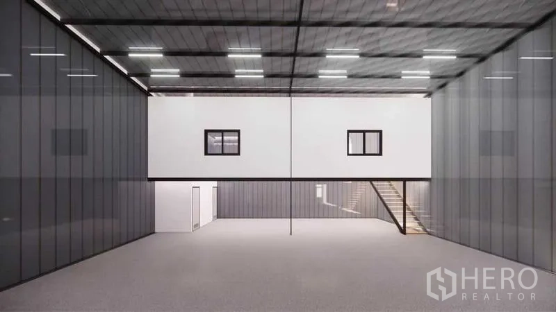 Warehouse for rent - High-ceiling warehouse interior with LED lighting, mezzanine office block, stairs and smooth concrete floor.