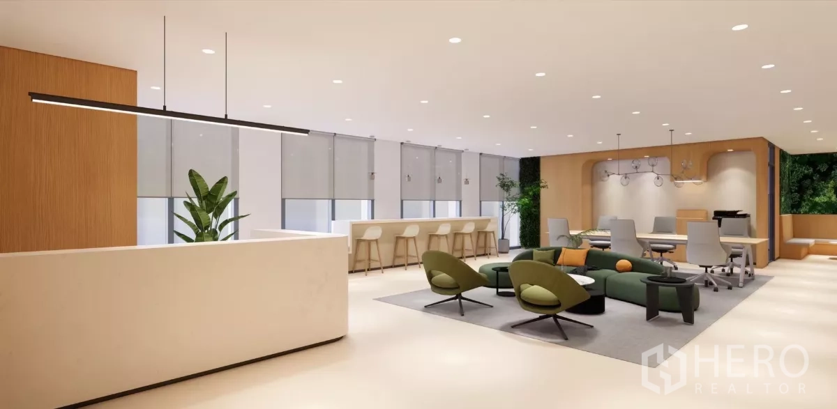 Office Space for rent in Huai Khwang, Bangkok - Open‑plan workspace with green lounge chairs, long worktable and a window bar counter.