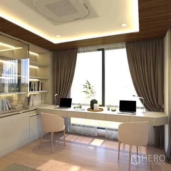 Townhouse for sale in Suan Luang, Bangkok - Bright home office with dual workstations, shelving and a large window.