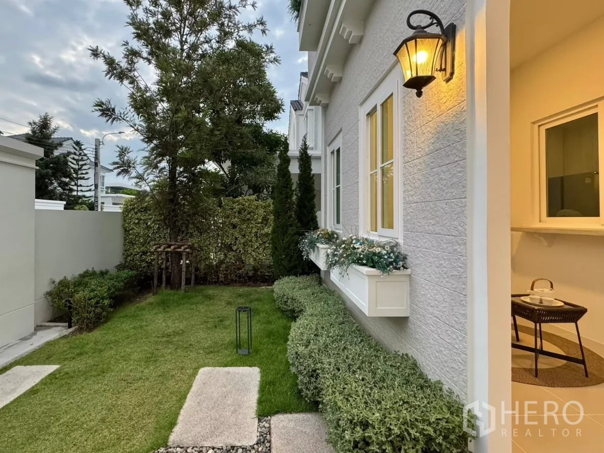 Detached House for rent in Bang Phli, Samut Prakan - Front garden with shrubs, window planters and pathway lights.