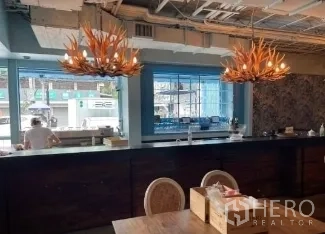 Retail Space for rent in Watthana, Bangkok - Bar counter with antler pendant lights and open service window.